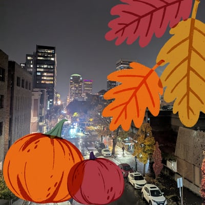 PSU campus at night, with overlaying graphics of orange pumpkins and fall leaves