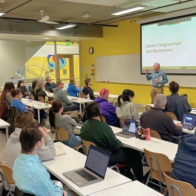 Former Congressman Earl Blumenauer presents to the 2026 Community Transportation Academy cohort. 
