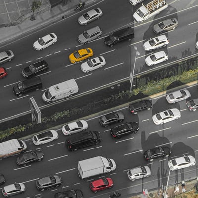 Cars wait on a multi-lane expressway. 