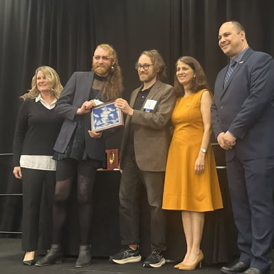 Students onstage accept the award at the CUTC banquet